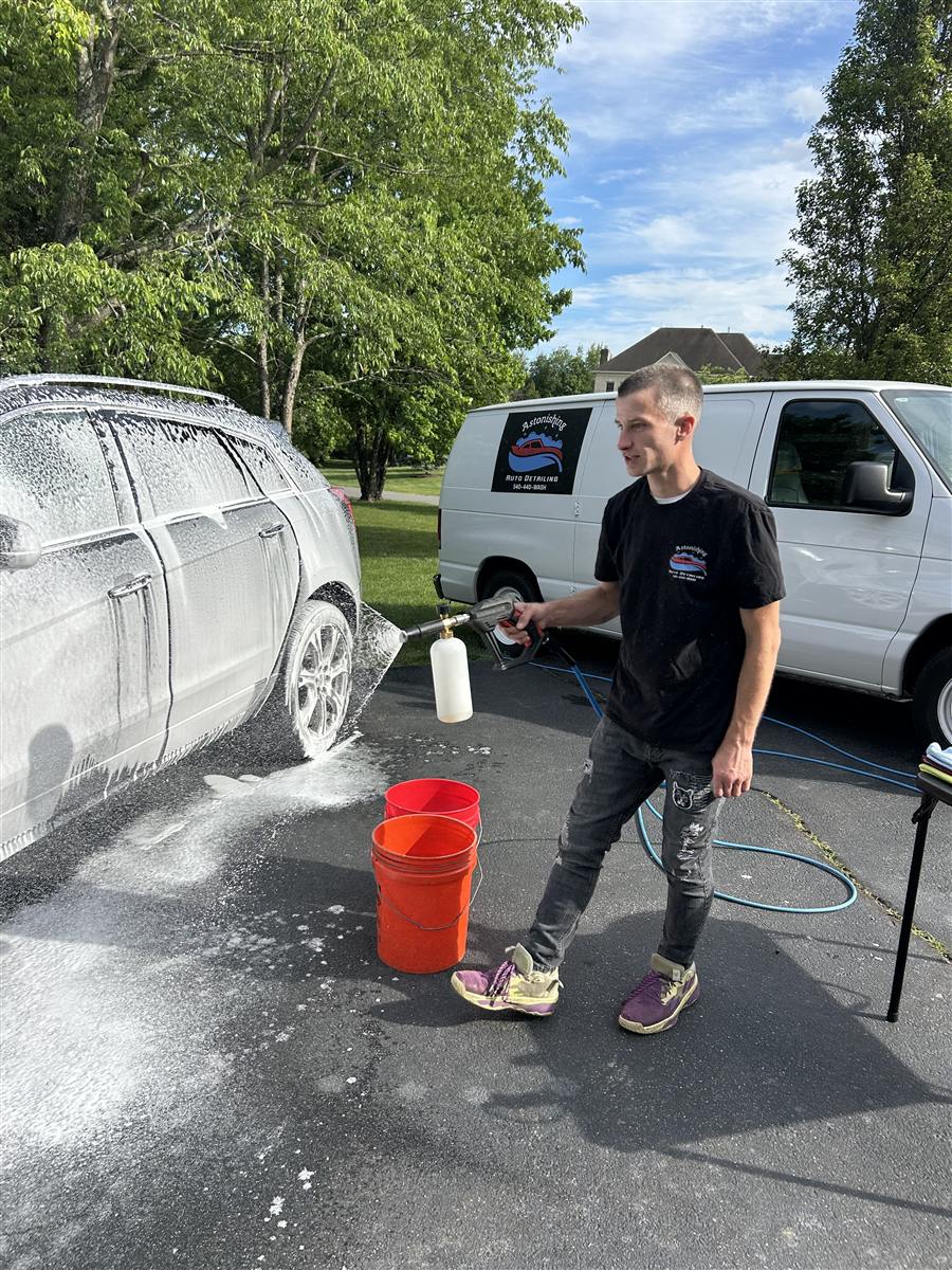 Foam washing beside the company van